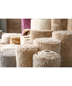 depositphotos_311107786-stock-photo-many-different-carpets-in-shop